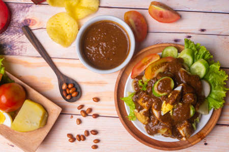 Gado Gado, Indonesian traditional food with many vegetable. egg, tomato, cracker, fried peanut, and potatoの写真素材