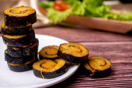 Nori Chicken Nugget, healthy food from vegetables on white plate and wooden table