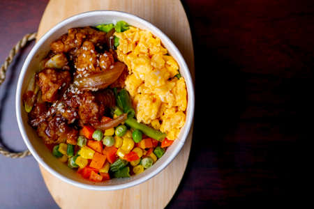 Indonesia style rice bowl, contain chicken katsu, egg, and vegetablesの写真素材