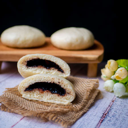 Bakpao, yeast-leavened filled bun in various Chinese cuisines, filling with chocolate