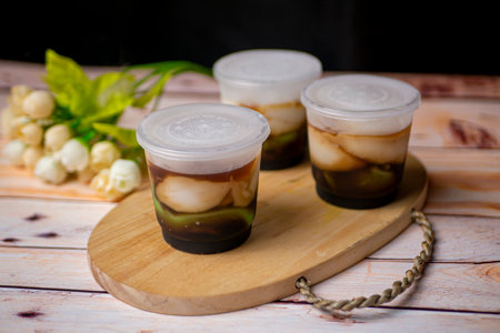 Lapis or Bubur Jongkong Indonesia's sweet porridge of rice flour, coconut milk and palm sugar syrupの写真素材