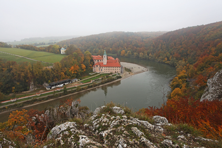 Misty view over monastery at Danube Riverの写真素材