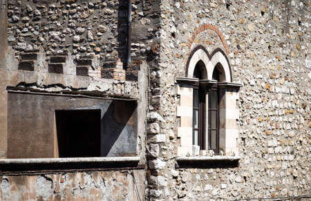 A wall of an old structure in the tourist destination of Taormina, Sicily.の写真素材