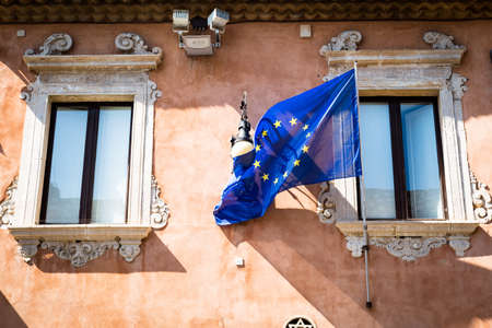 EU flying from a building in Taormina, Sicily.の写真素材