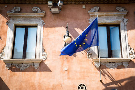 EU flying from a building in Taormina, Sicily.の写真素材