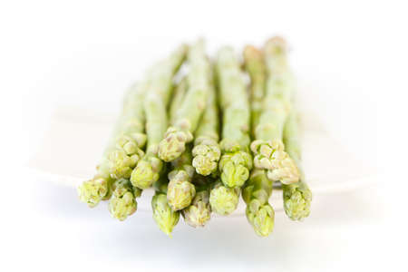 green fresh asparagus on white backgroundの写真素材
