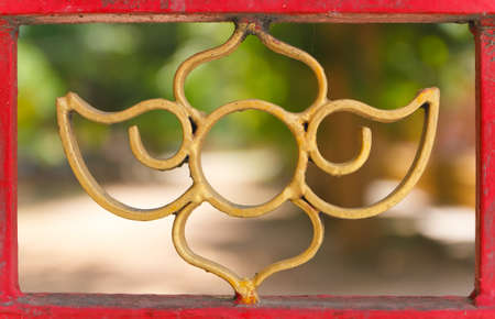 curved steel gate work  paint the goldの写真素材
