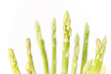 green fresh asparagus on white backgroundの写真素材