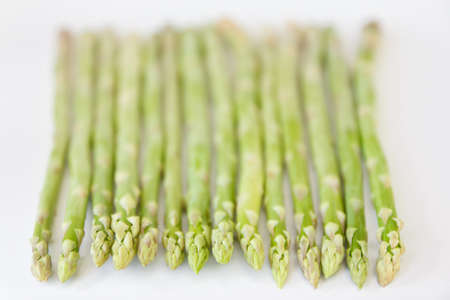 Fresh asparagus on a white backgroundの写真素材