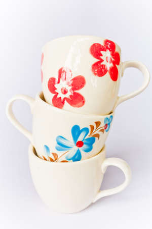 Colorful ceramic cup on a white screen.の写真素材