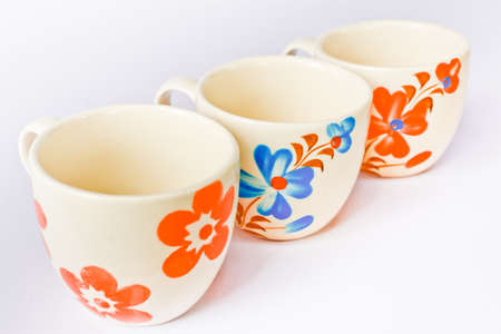 Colorful ceramic cup on a white screen.の写真素材