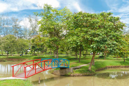 The colorful bridge of steel, in a quiet park 