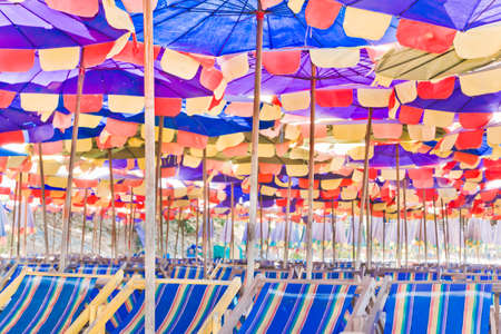 Beach umbrellas and chairs, colorful の写真素材