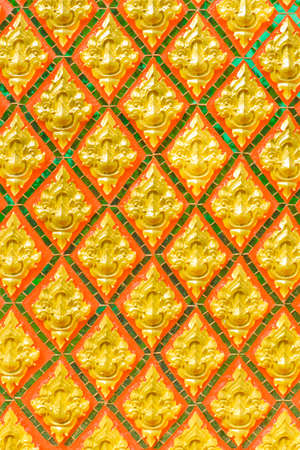 Stucco work, style Thailand, on the temple walls の写真素材