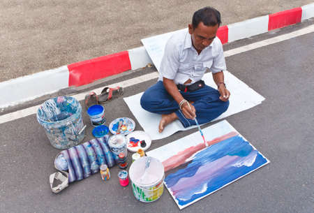 SATUN, THAILAND - MARCH 2: unidentified artist, drawing roadside. on walking street . on March 2,2013 Satun Thailand.のeditorial素材