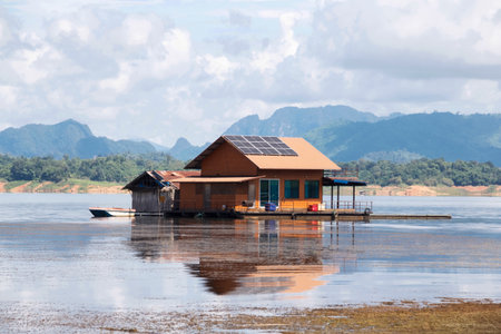 The house that floats in the lake has solar cells on the roof.の写真素材