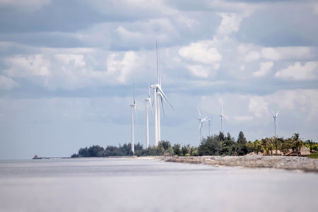 Large wind turbines by the sea in southern Thailandの写真素材