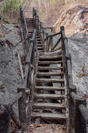 Wooden stairs leading to the top of the mountain in Thailand.の写真素材