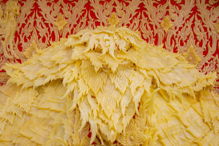 Thai candle wax carving in Buddhist temple, closeup of photoの写真素材