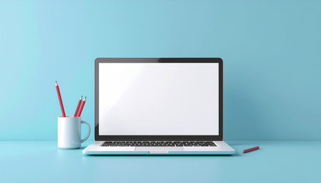 Laptop with blank screen and pencils on blue background, 3D renderingのイラスト素材