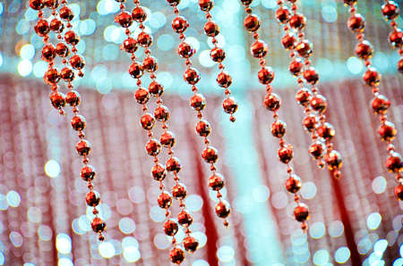 Bead curtain with cream-colored walls. Selective focusの写真素材