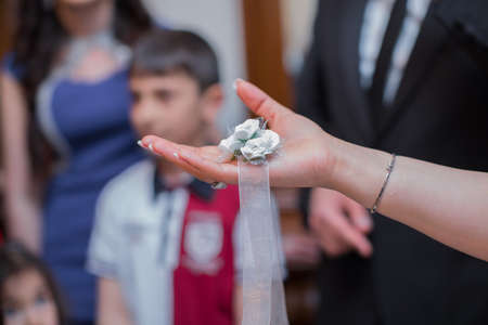 The bride's hands were tied to the wedding robeの写真素材