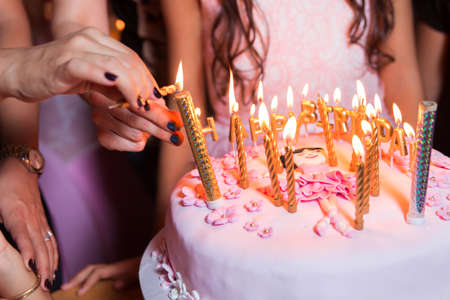 They burn candles on the birthday. Yellow candlesの写真素材