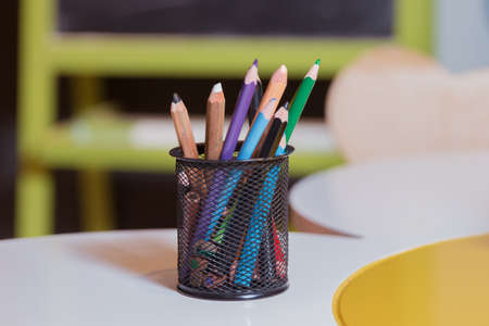 Crayons in a bowl . Color pencils for the drawing, located in a support as a vase . Multicolored pensの写真素材