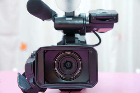 Professional full HD camcorder. Professional video camera isolated.の写真素材