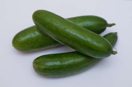 Cucumber isolated on white background . Three cucumber on a white background . vegetables on the white isolated background. Studio photo . Tasty kitchen. Fresh vegetables isolated on whiteの写真素材