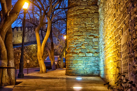 The fortress gates of the old city in the illumination . Icheri Sheher in night Baku. Azerbaijan . Gate of the old fortress, entrance to Baku old town.の写真素材