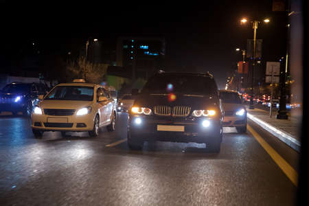 Night view of the cars. Road in the city at the night with yellow and red electrical light for cars...