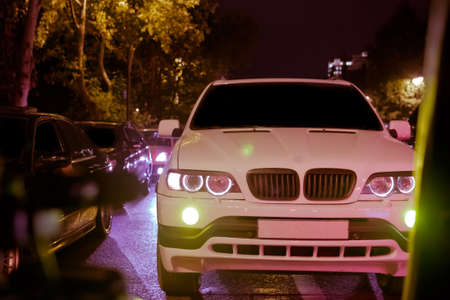 Road in the city at the night with yellow and red electrical light for cars during they are coming home. The cars compete at night. Only the lights of night carriages.の写真素材