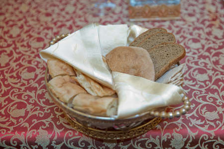 Crusty bread bruschetta in wooden bowl . Chopped bread in a copper bowl