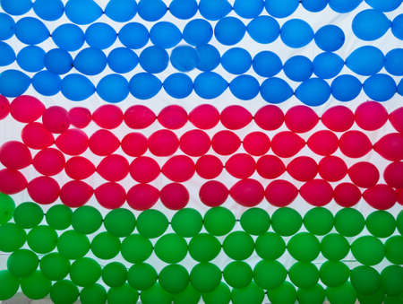 Grunge colorful background, flag of the Republic of Azerbaijan. Close-up, fluttering downwindの写真素材