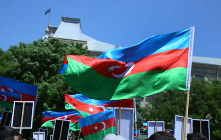 Azerbaijan flag in Baku, Azerbaijan. National sign background. Red Green Blue flag. Azerbaijan national flag with Crescent moon. Azerbaijan tradition patriotic. Flags waving windの写真素材