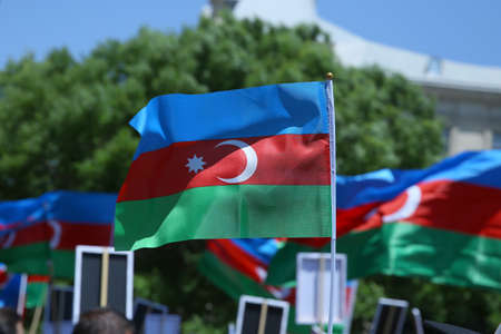 Azerbaijan flag in Baku, Azerbaijan. National sign background. Red Green Blue flag. Azerbaijan national flag with Crescent moon. Azerbaijan tradition patriotic. Flags waving windの写真素材