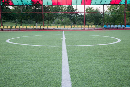 Football defocused players penalty on field Small, Futsal ball field in the gym indoor, Soccer sport field . Corner of a soccer field . Mini Football Goal On An Artificial Grass .の写真素材