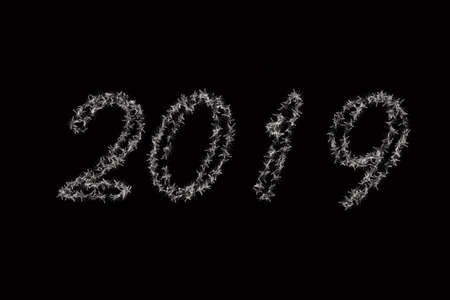 2019 is written with snow . Black background 2019 article . White 2019 New Year of on black...