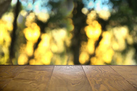 Autumn Wooden board empty table in front of blurred background . Empty wooden table in front of...