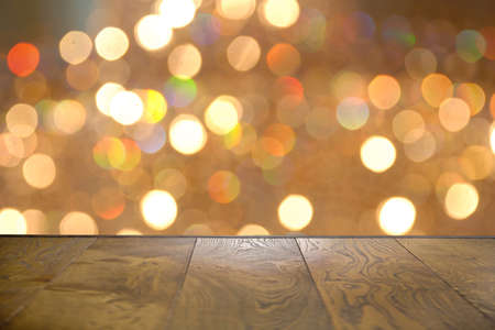 Autumn Wooden board empty table in front of blurred background . Empty wooden table in front of abstract blurred background of coffee shop .の写真素材