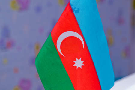 Tooth pick wit a small flag of Azerbaijan. Azerbaijan table flag with black Background . Mini flag.の写真素材