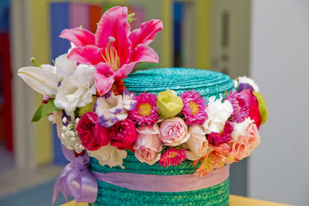 Colorfull Flower arrangement in a hat box , a pot of cyan for a girl on a gift with roses ....