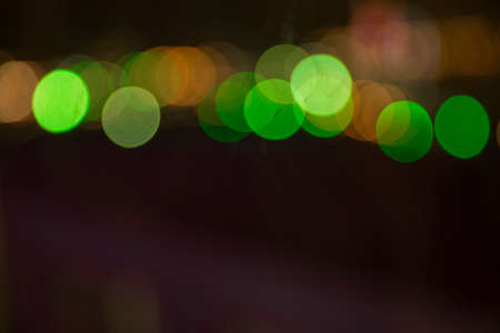 Abstract Lights. Unfocused Light background. Blured night light. bokeh background, Blur concept . Abstract unfocused blured bokeh light dots background . Defocused christmas lights backgroundの写真素材