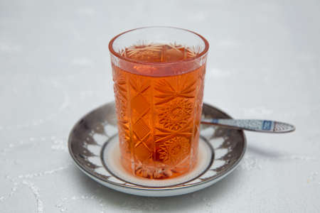 Glass of Azerbaijan tea isolated on white . Cup of tea isolated on white . Azerbaijan tea in traditional glass isolated on white backgroundの写真素材