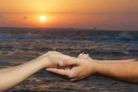 They caught the sun in their families. Sunrise .Held hands in the background of the sun and the sky....