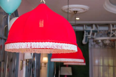 Pendant light lamps isolated . interior of restaurant with big lamps in red light .の写真素材