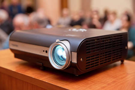 LCD video projector at business conference or lecture in office with copy space . LCD video...