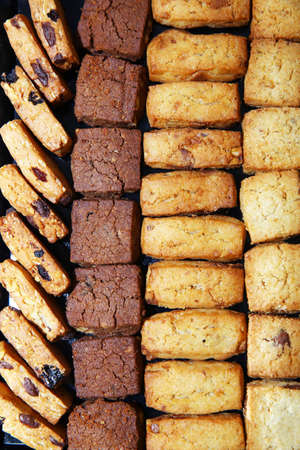 black yellow square cake .cakes baked in a pod. Coffee break breakfast at the hotel.Luxury hotel restaurant deserts open buffet. Table with deserts, Sweet desserts and pastries on the table .barleyの写真素材