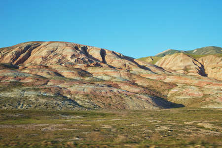 View of the beautiful striped red mountain . Red mountains in Xizi, Azerbaijan. Colorful hills ....